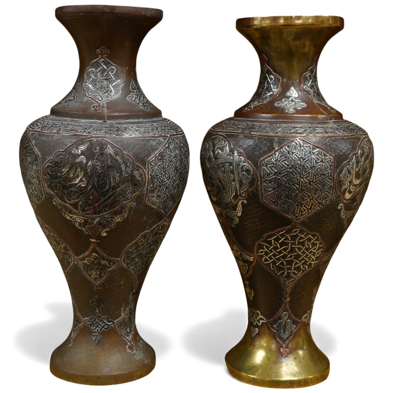 A pair of Cairoware silver and copper inlaid brass vases, 24cm high